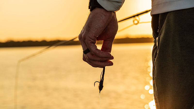 Bask in the splendor of images depicting the serene art of fishing on the majestic rivers and sun-kissed lakes of our world.